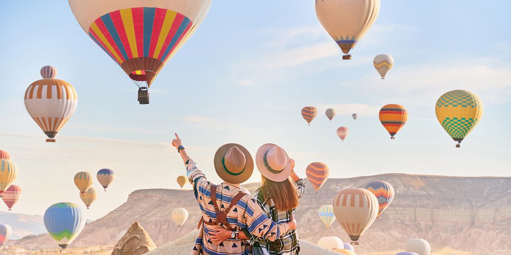 Scenic view of hot air balloons flying