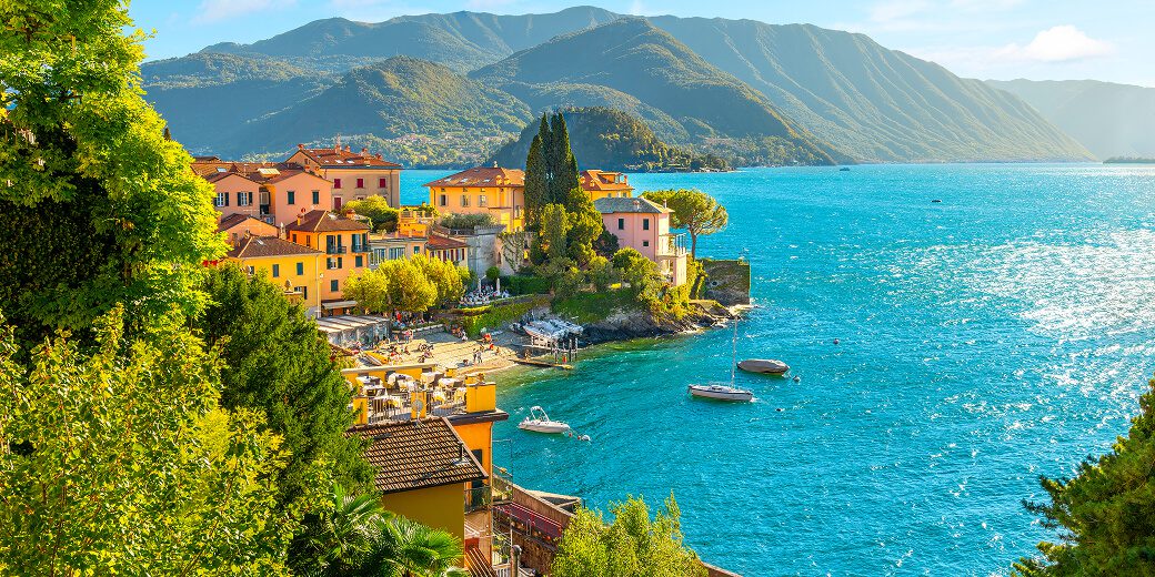 Colorful lakeside town with mountain backdrop
